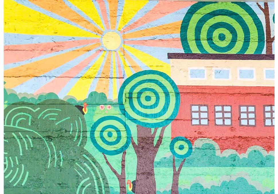 Art, detail of mural painted at bus stop featuring brightly coloured landscape of Newmarket, by Maya Walke