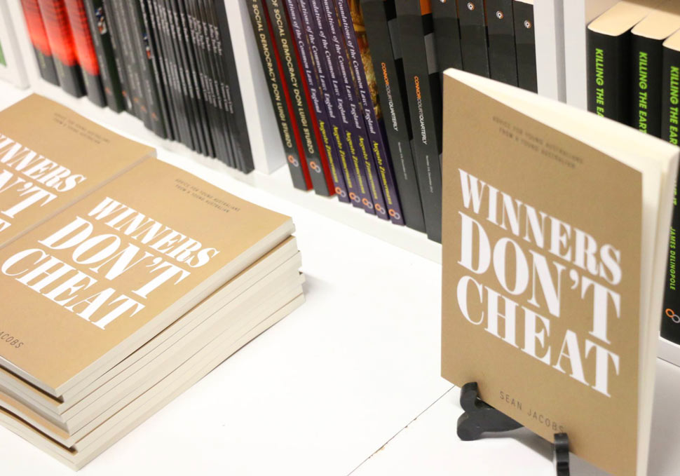 Graphic design, Winners Don't Cheat book on shelf, cover artwork by Maya Walker