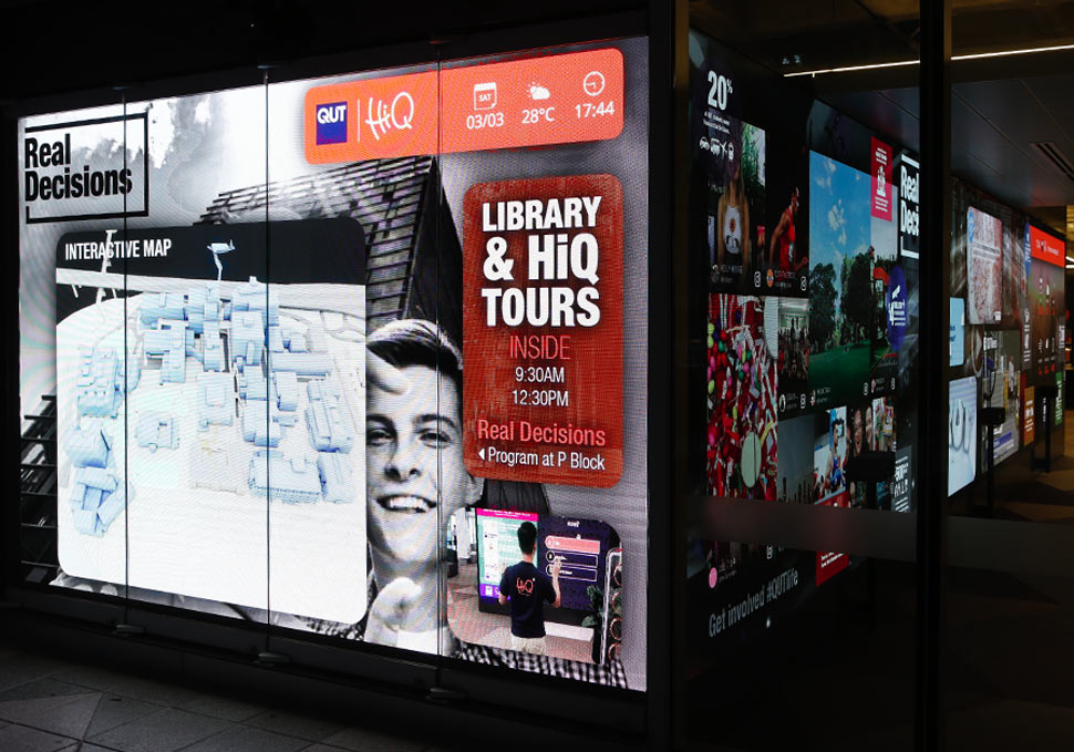 Graphic design, view from outside building of QUT HiQ Gardens Point LED wall with digital content by Maya Walker
