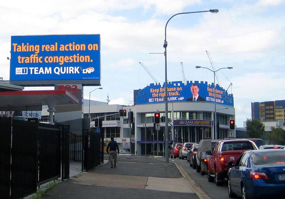 Graphic design, two Lord Mayor Graham Quirk digital billboards at busy intersection in The Valley, Brisbane, by Maya Walker